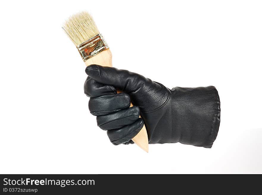 Brush in a hand on a white background