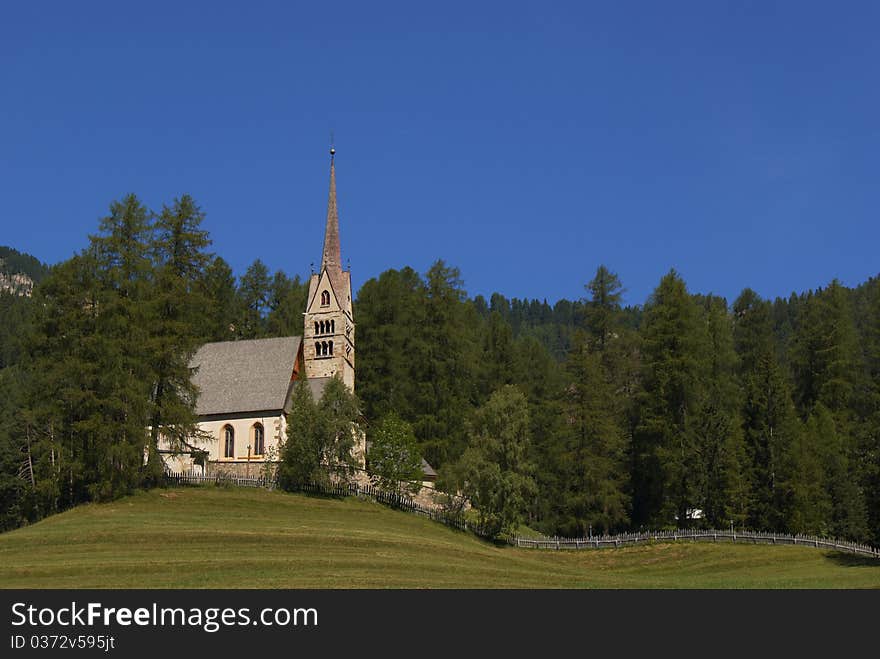 A small church surrounded by forest in Italian Alps. A small church surrounded by forest in Italian Alps