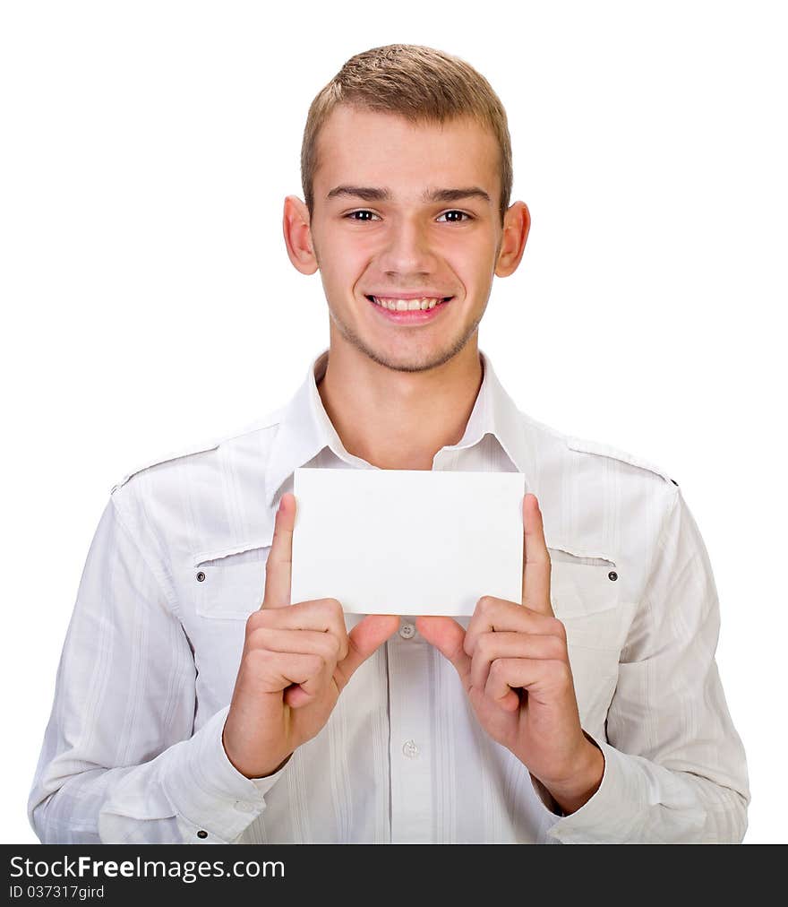 Portrait of a happy young man holding a blank board for texting against white