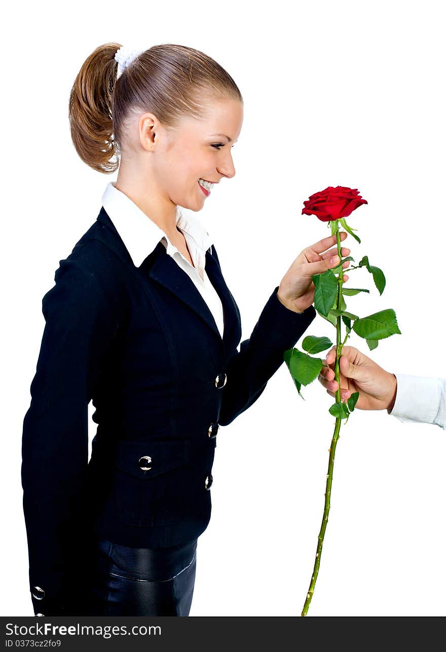 The man gives to the beautiful girl a red rose.