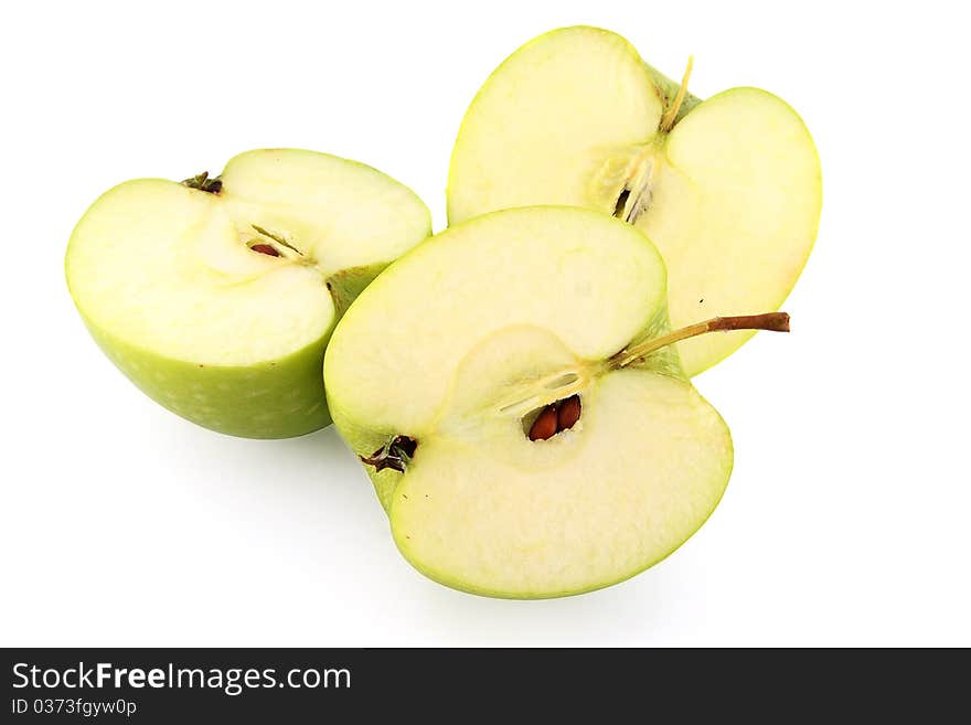 Cutted green apples on white