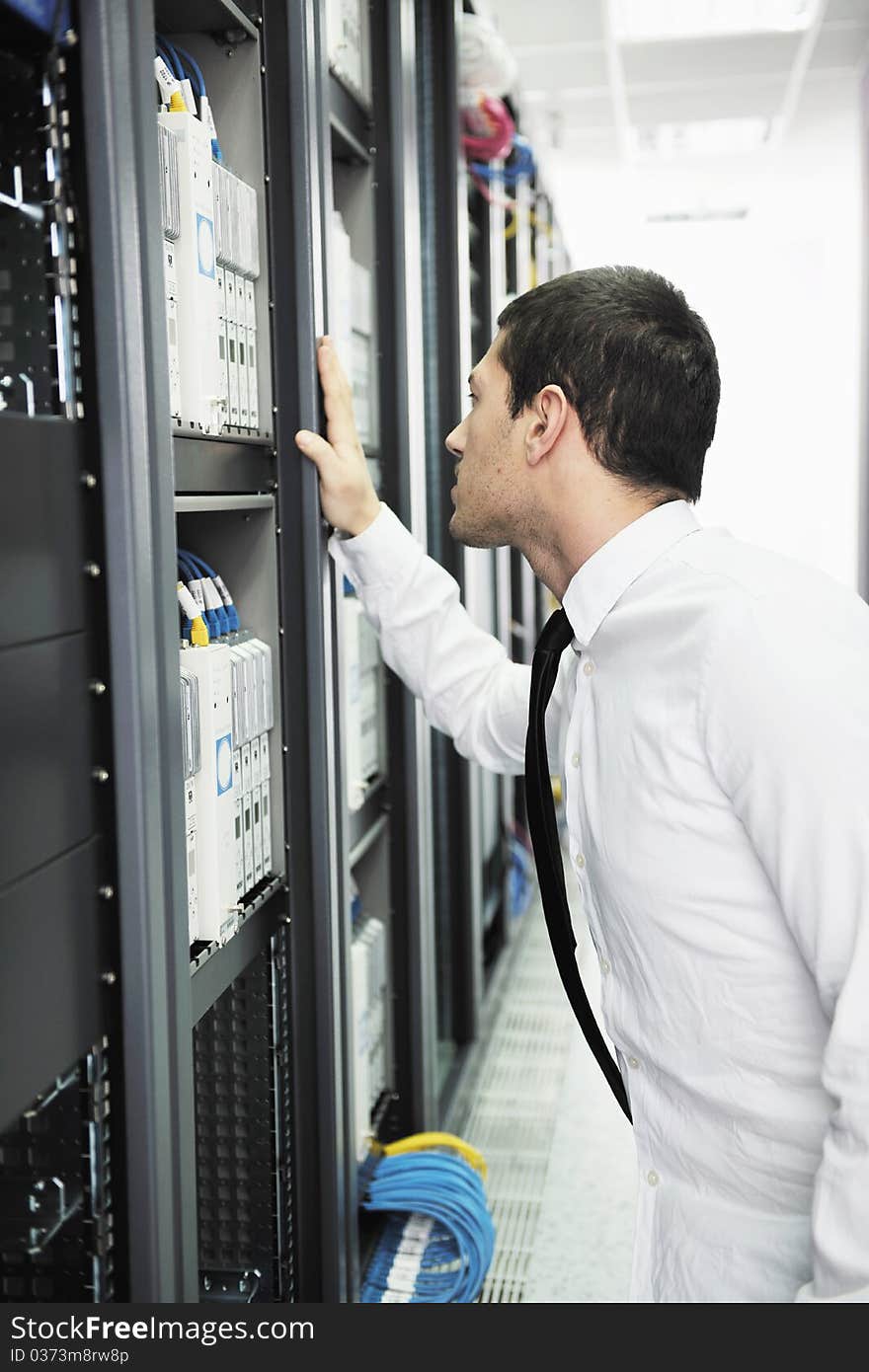 Young It Engeneer In Datacenter Server Room