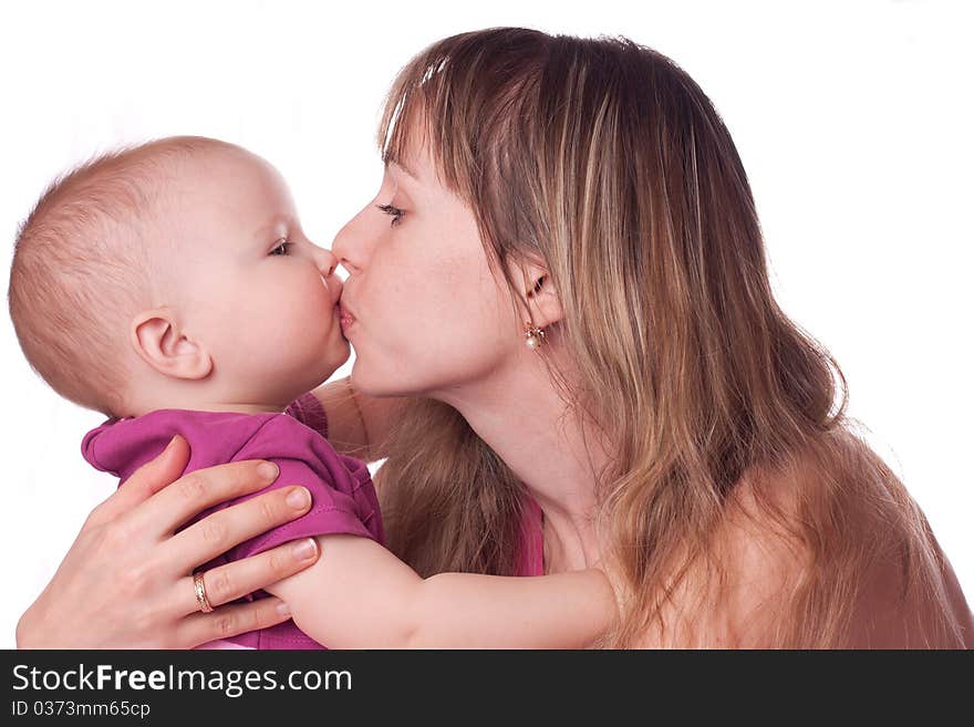 Mother kissing daughter isolated on white. Mother kissing daughter isolated on white