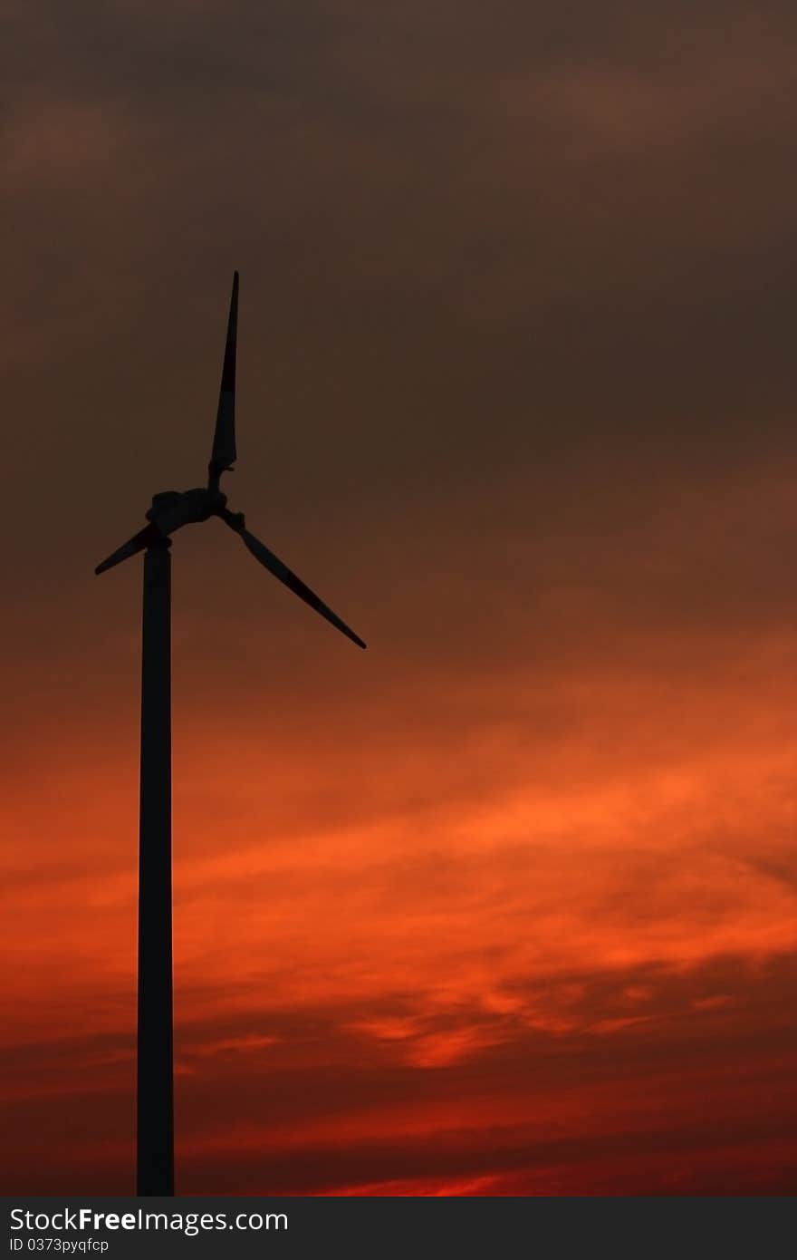 Windmill with the colorful sky on sunset time