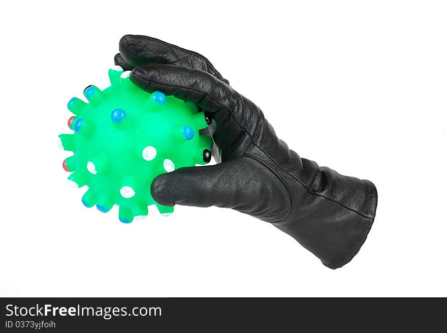 A hand in a glove holds a ball