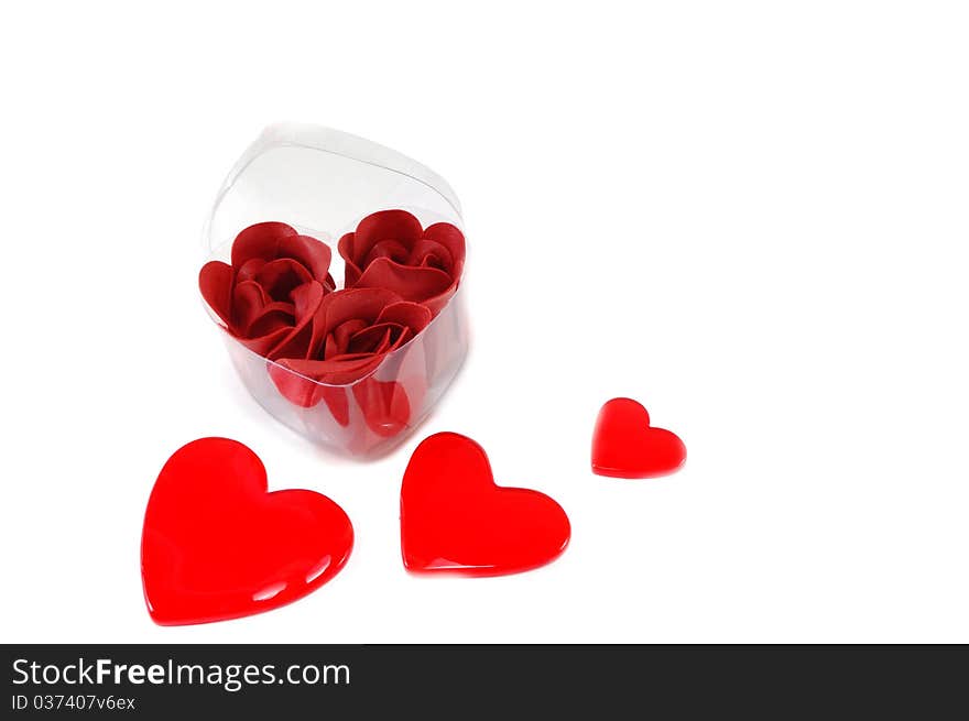 Box with roses and heart is isolated on a white background