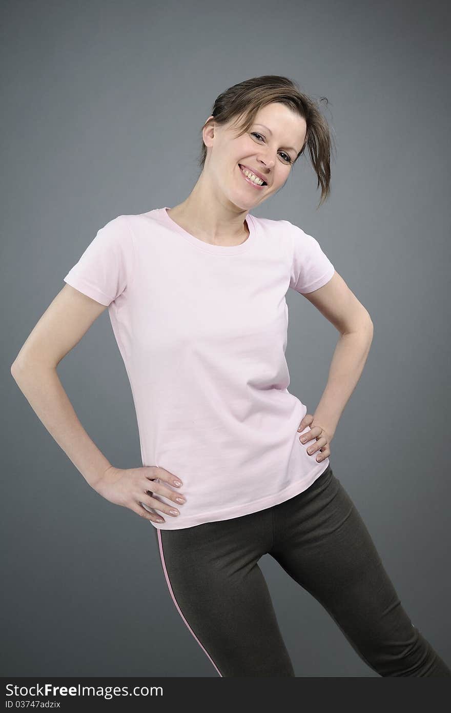 Joyful aerobic instructor exercising