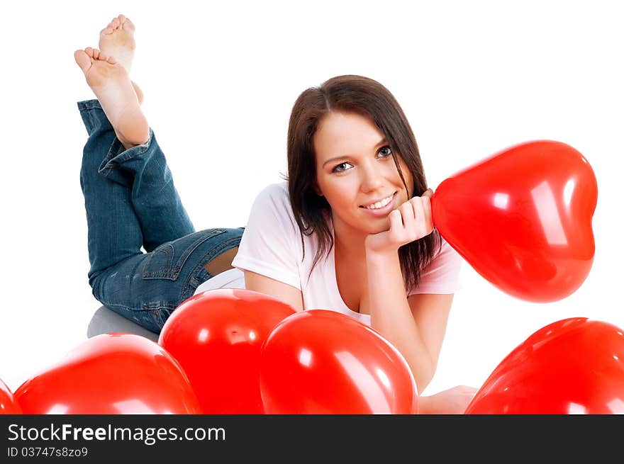 Young brunette with red hearts isolated