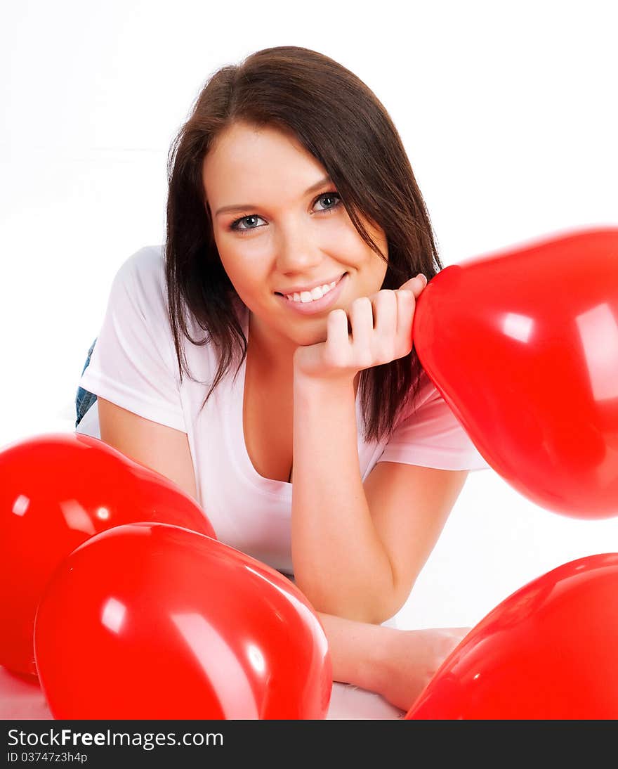 Young brunette with red hearts isolated