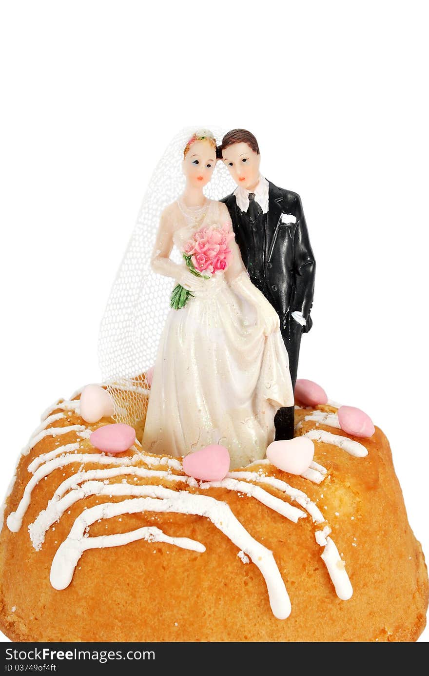 Bride groom figurines on a cake isolated