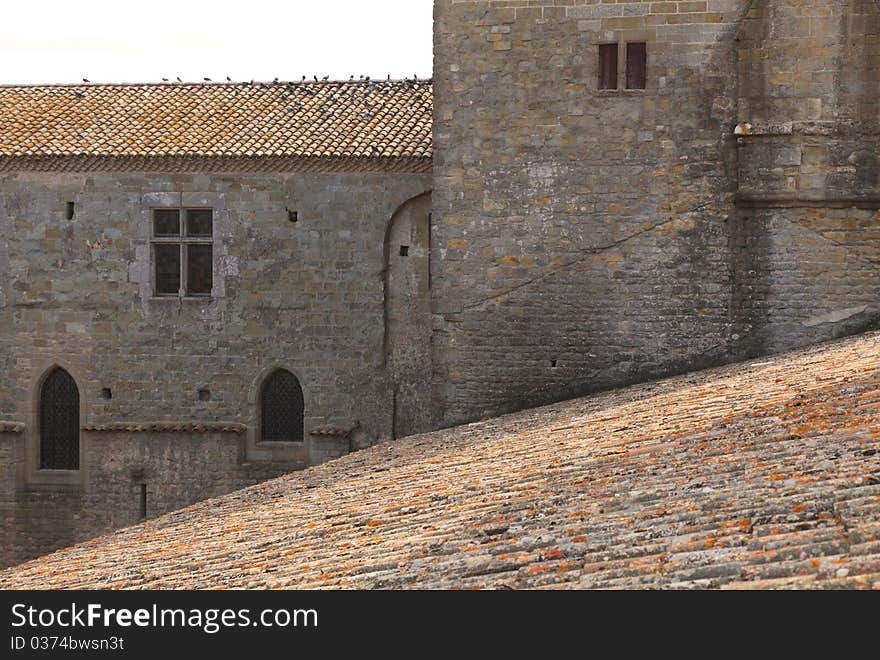 Image of roofs and wall in Carcassonne fortress.Carcassonne is a very famous fortified medieval town located in the Languedoc-Roussillon (Aude department) region in the South of France. More images in my Carcassonne collection. Image of roofs and wall in Carcassonne fortress.Carcassonne is a very famous fortified medieval town located in the Languedoc-Roussillon (Aude department) region in the South of France. More images in my Carcassonne collection.