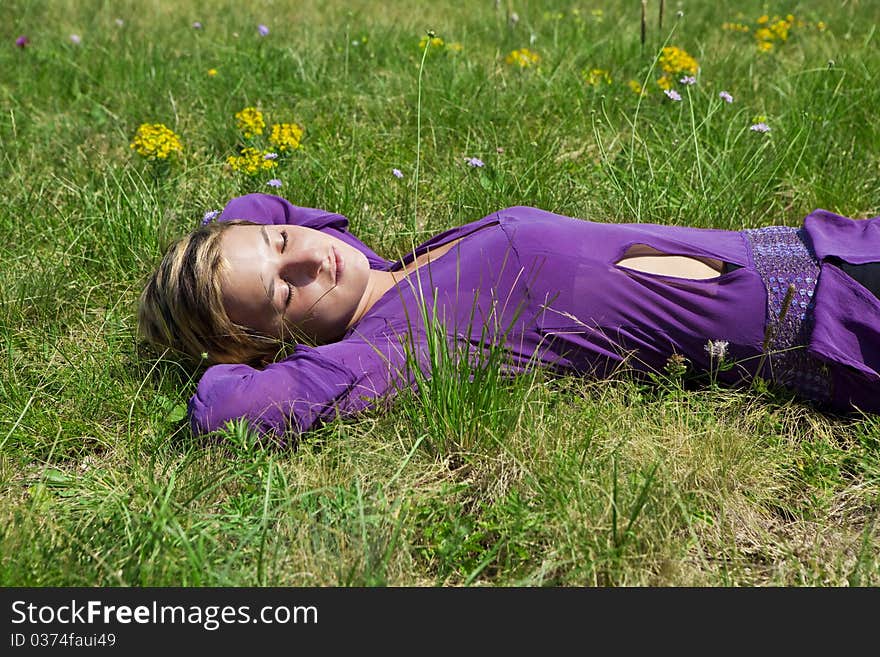 Young girl relaxing on the grass