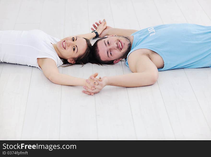 Young man in fintess sport club exercise withweights and relaxing. Young man in fintess sport club exercise withweights and relaxing