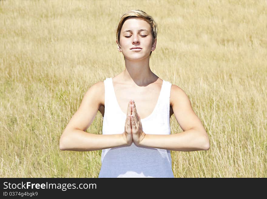 Young woman practicing yoga outdoor