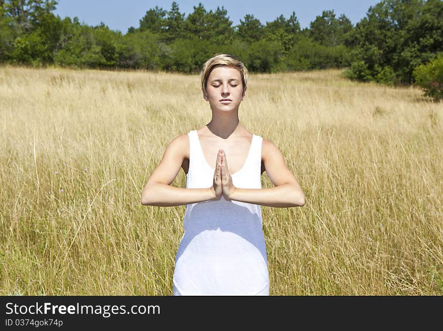 Young woman practicing yoga outdoor