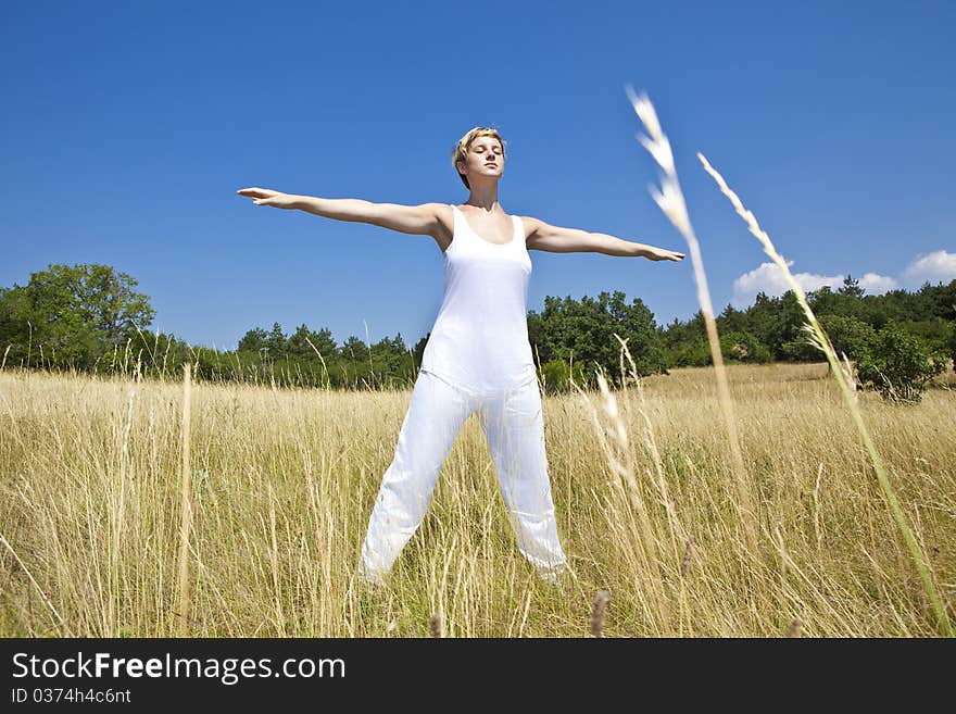 Young woman practicing yoga outdoor