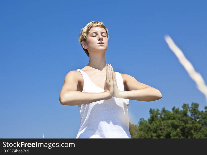 Young woman practicing yoga outdoor