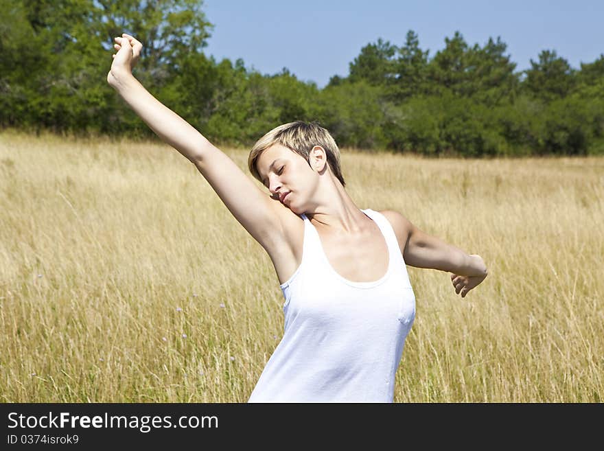 Young girl enjoying freedom in a field