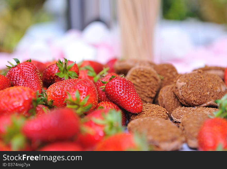 Platter of strawberries and chocolate biscuits. Platter of strawberries and chocolate biscuits