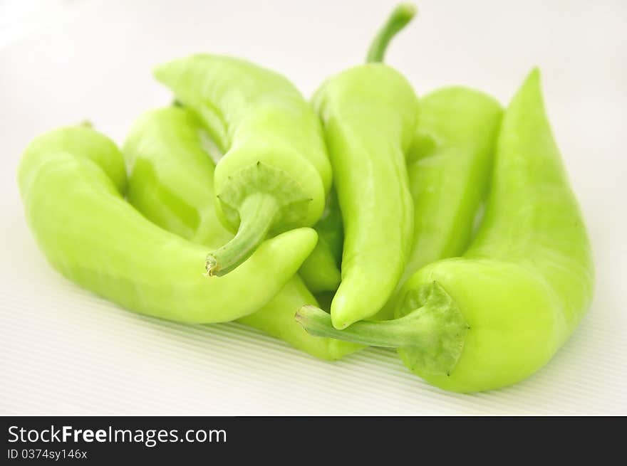 Fresh green paprika on white background