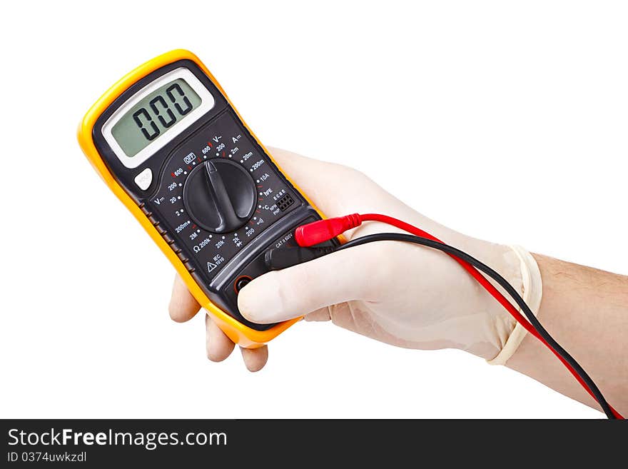 Hand in rubber glove holding an electronic tester. Hand in rubber glove holding an electronic tester