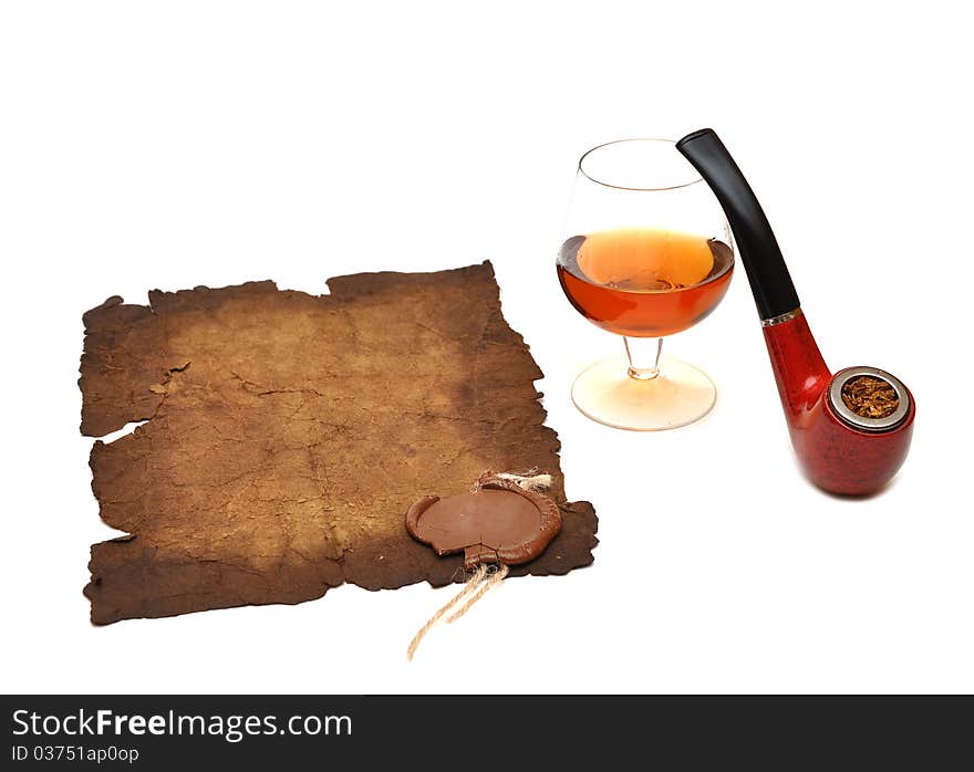 Old paper seal wax , pipe and glass of cognac on white