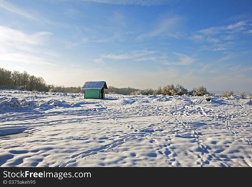 Walking traces to alpine shelter in winter time