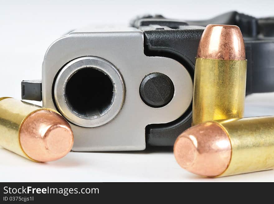 Close up image of 40mm pistol with bullets. Close up image of 40mm pistol with bullets