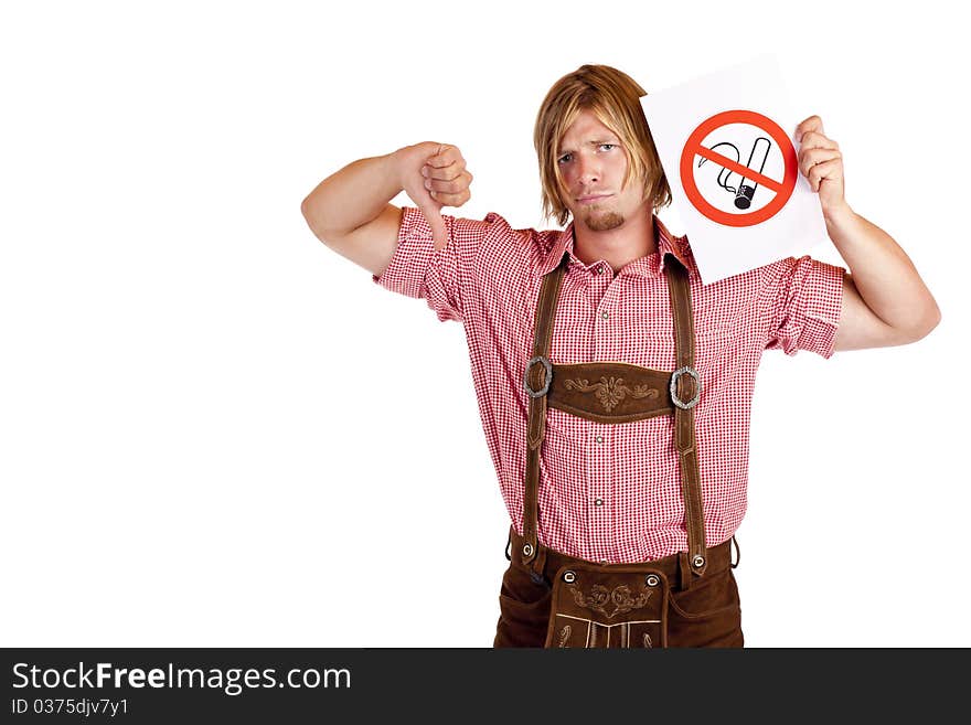 Bavarian man in lederhose disagrees to non-smoking-rule. Isolated on white background.