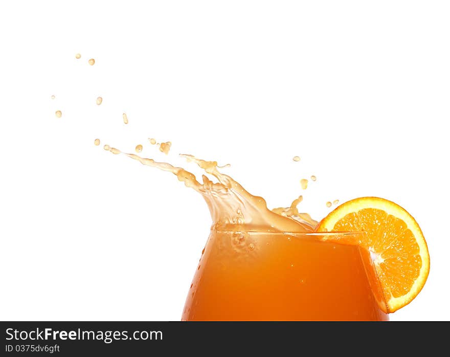 Glass of splashing orange juice isolated on white background with clipping path. Glass of splashing orange juice isolated on white background with clipping path