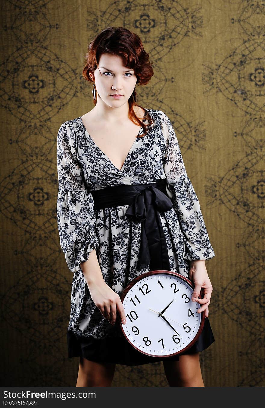 An image of a woman with a clock