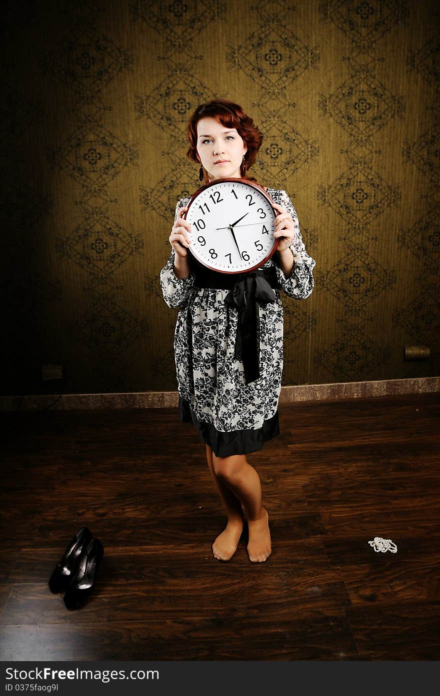 An image of a woman with a clock