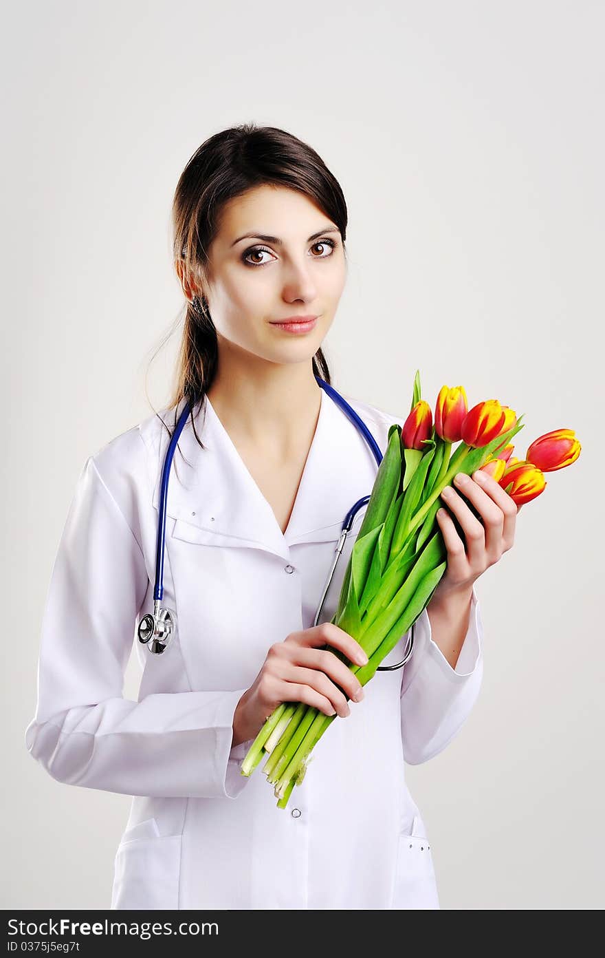 An image of doctor with tulips