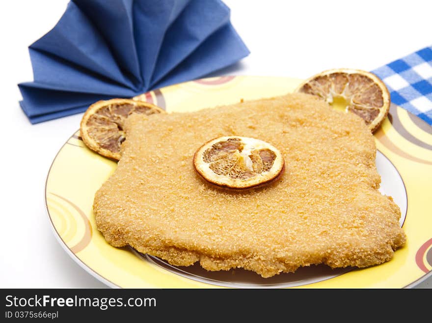 Escalope raw with lemon and napkin