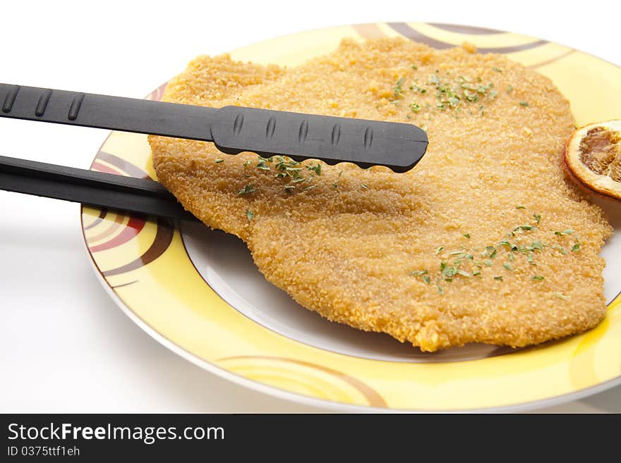 Escalope raw with lemon and grill tie. Escalope raw with lemon and grill tie