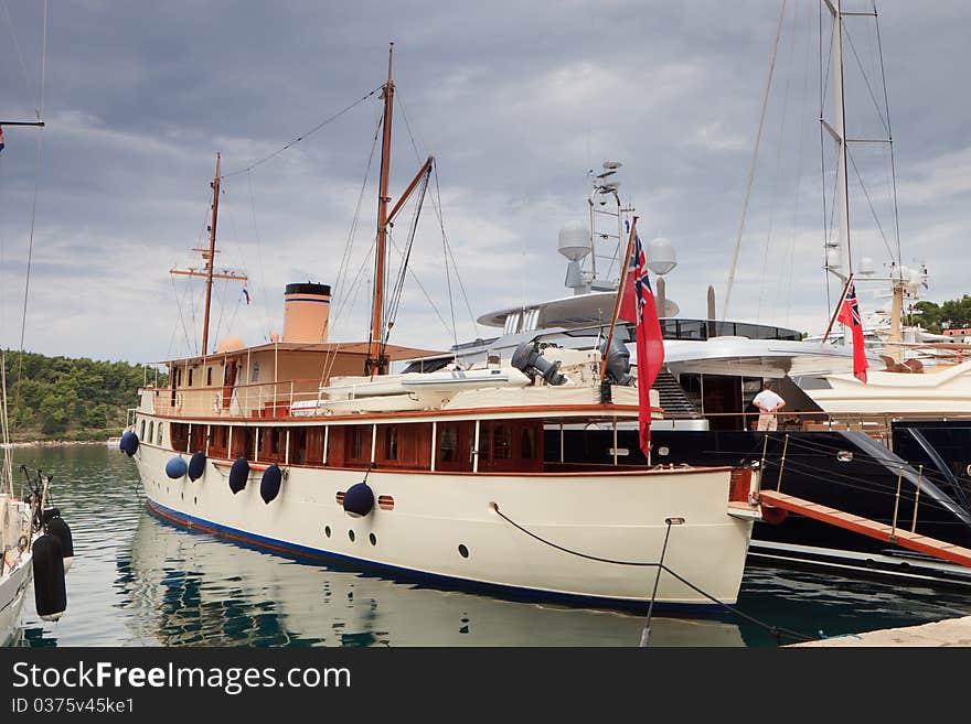 Old fashioned retro steam boat at dock. Old fashioned retro steam boat at dock