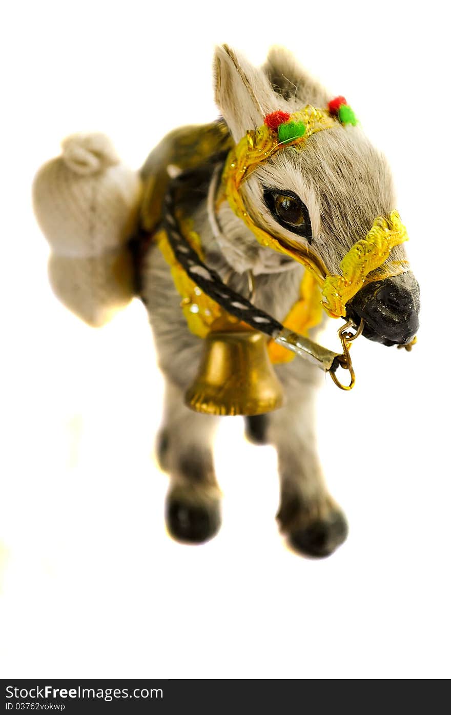 The kind burro with a hand bell on a white background