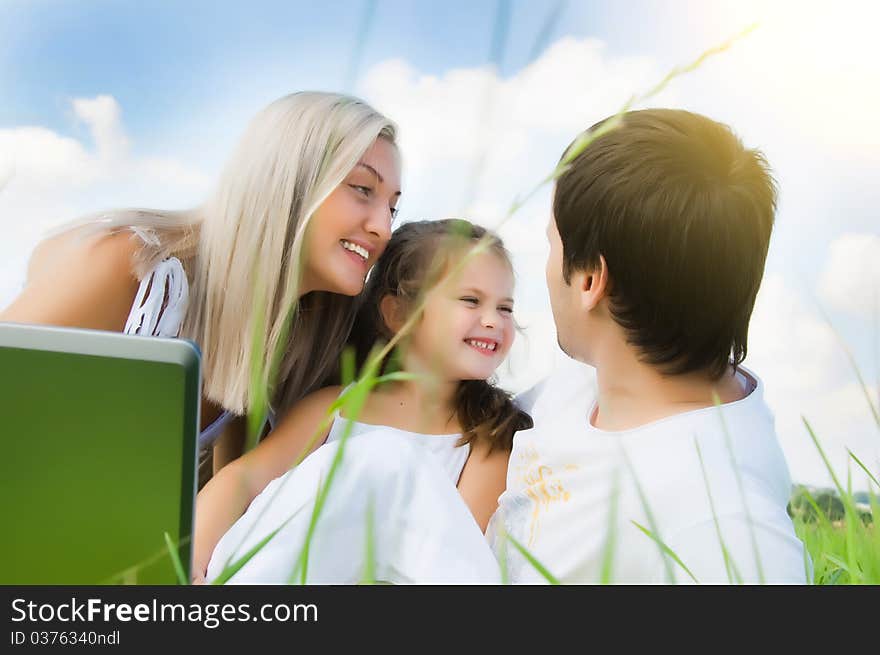 Happy family enjoy on the meadow. Happy family enjoy on the meadow