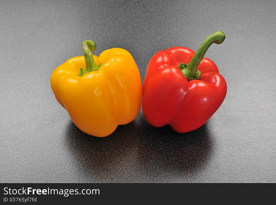 Two peppers on a kitchen table