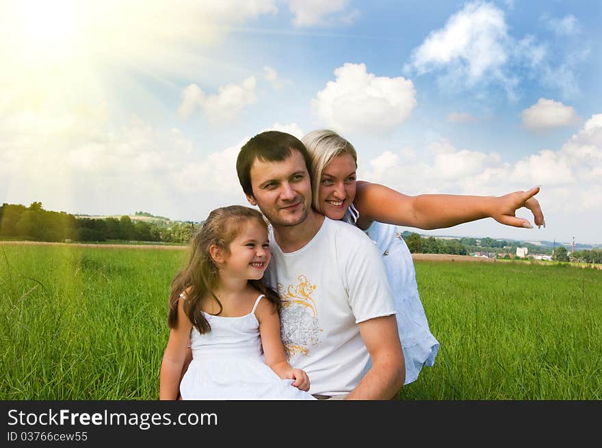 Playful young family on the meadow. Playful young family on the meadow