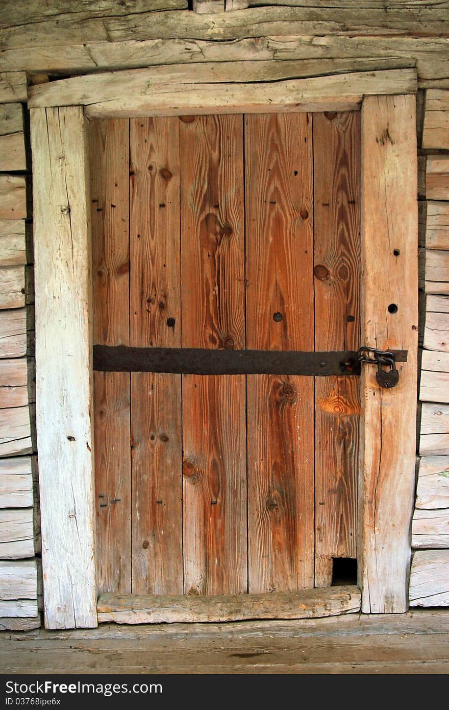 Old door with a large iron lock