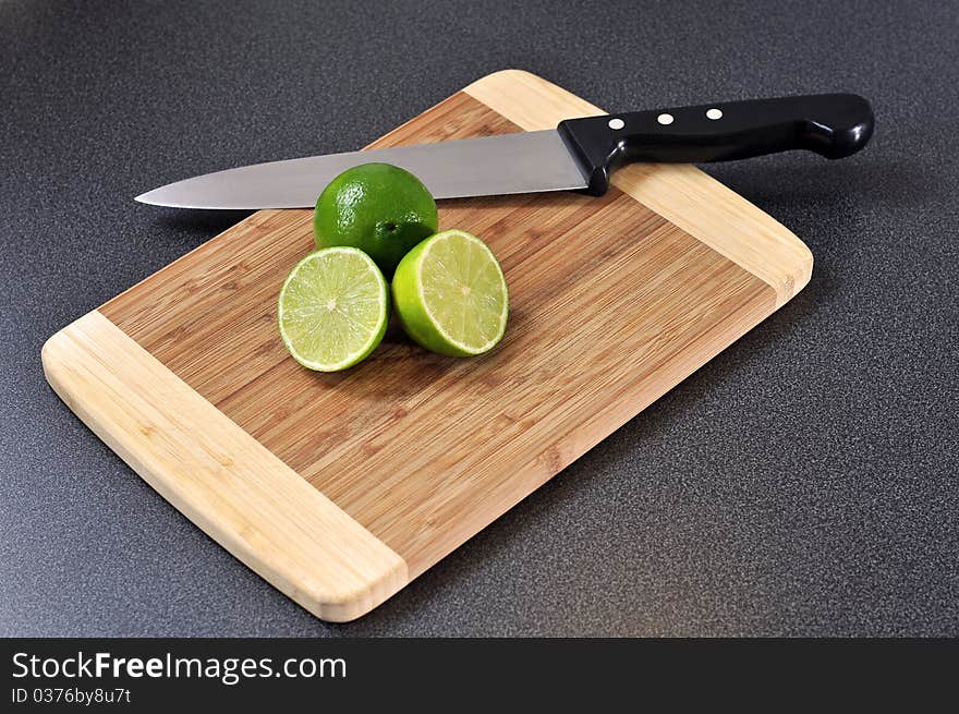 Sliced lime on a wooden plate