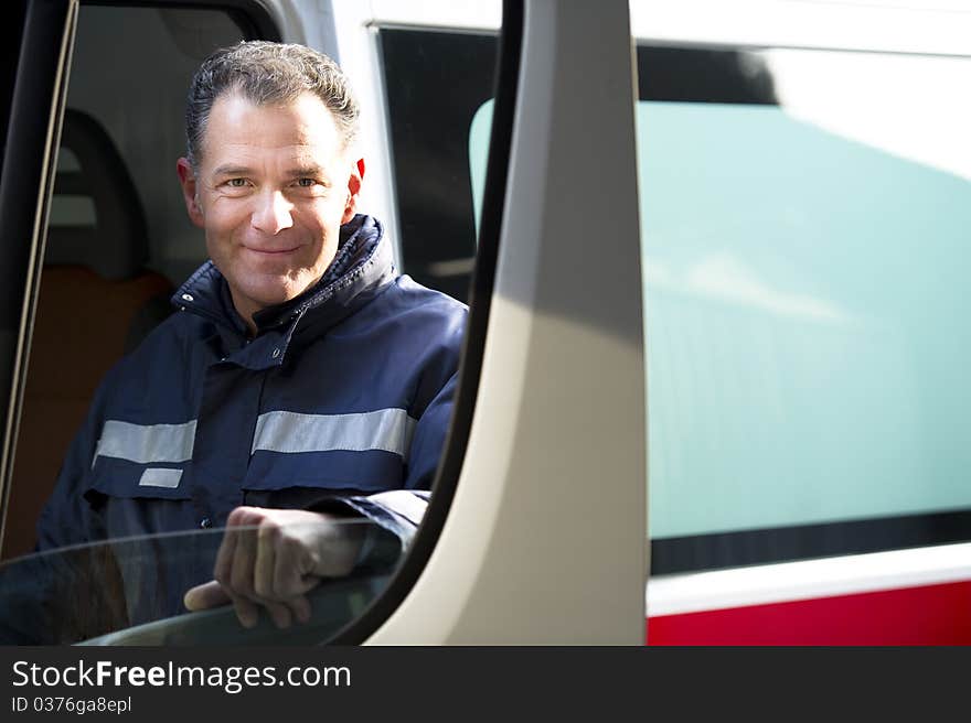 Portrait Of A Male paramedic driving ambulance