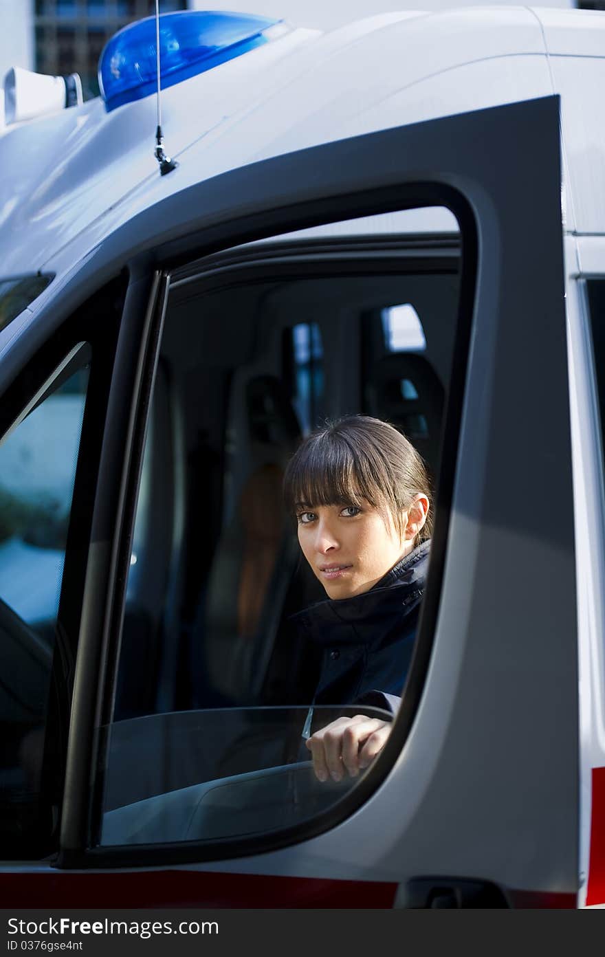 Portrait Of A Female Paramedic Driving Ambulance