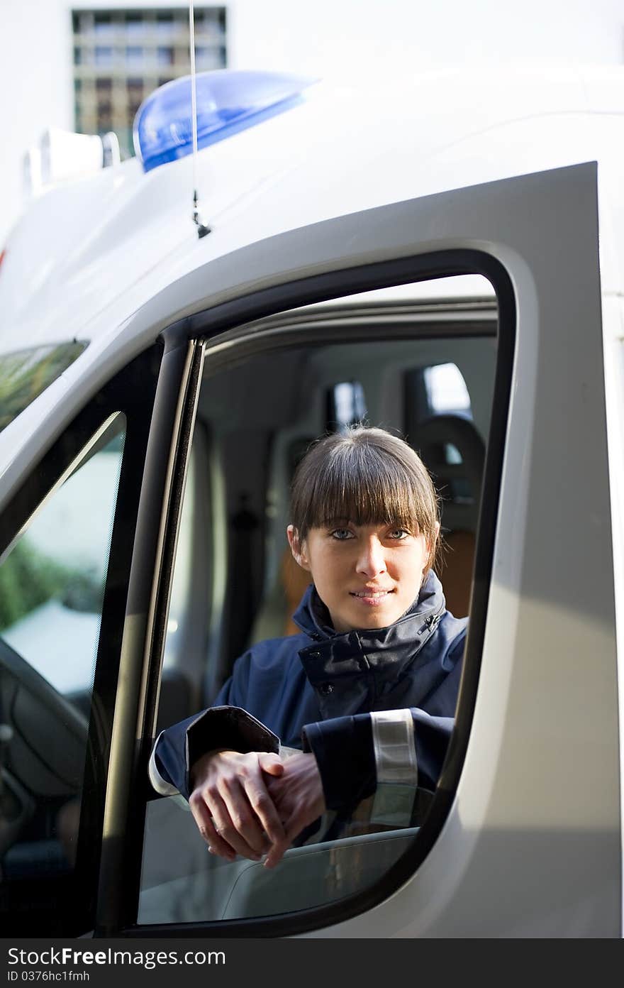 Female Paramedic Driving Ambulance, close-up