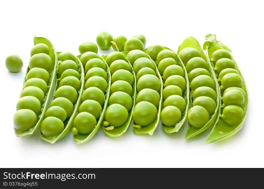 Many of ripe green peas on a white background. Many of ripe green peas on a white background