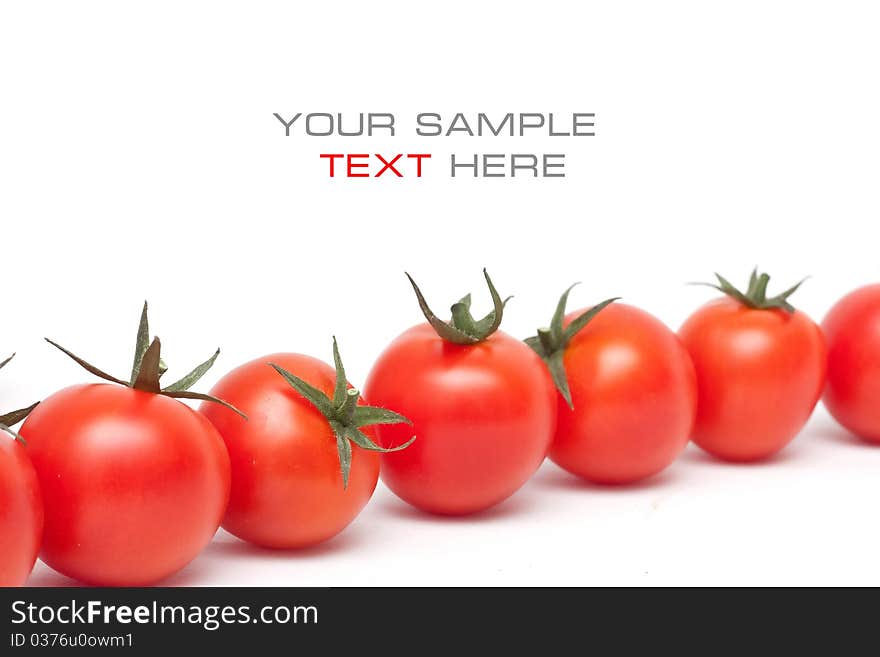 Ripe red cherry tomatoes on white background