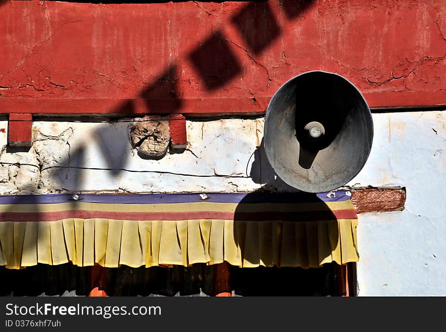 Detail of the Jokang Vihara monastery from Leh, Ladakh, India. Praying flags and a megaphone are visible. Detail of the Jokang Vihara monastery from Leh, Ladakh, India. Praying flags and a megaphone are visible.