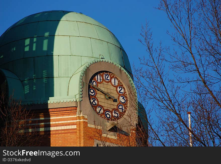 A clock with a blue sky. A clock with a blue sky