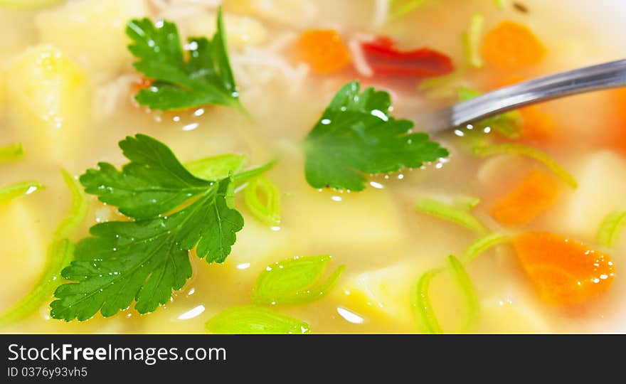 Vegetable soup with patatoes and carrots in white bowl. Vegetable soup with patatoes and carrots in white bowl.